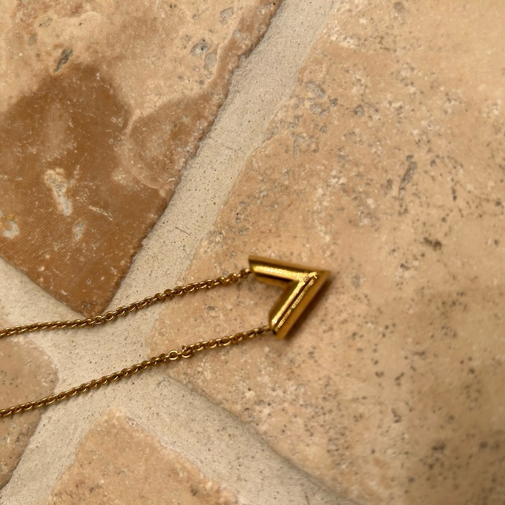 Authentic Louis Vuitton yellow gold “V” necklace and matching earrings.